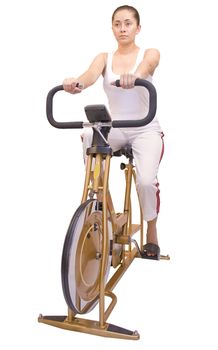 Woman on exercise bike isolated on white