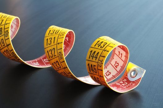 yellow measuring with copyspace on a dark background