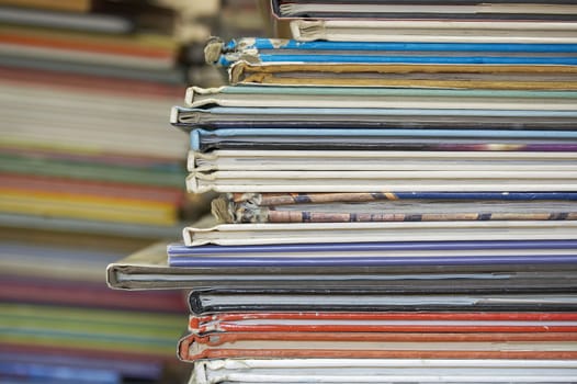 a lot of books stacked on a table