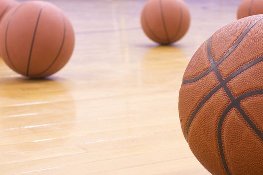 basketballs on gym floor