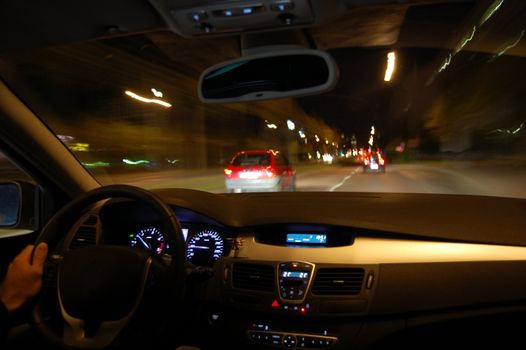 night drive with car in motion through the city shows the speed