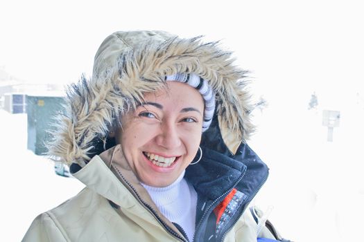 Woman in snow with furry coat