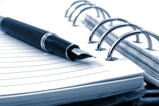 business pocket planner and pen ready to note an appointment