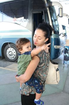 Mother and child boarding a bus