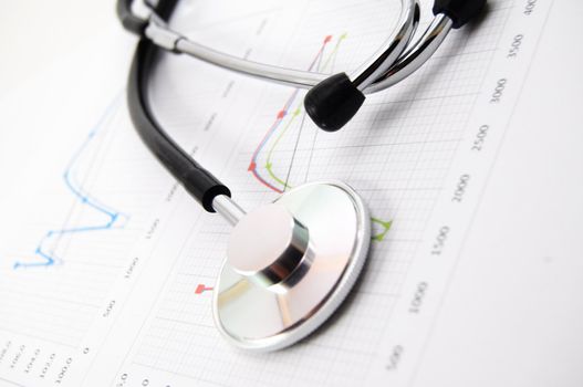 stethoscope on medical data chart in hospital