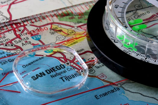 USA map with the city of San Diego and a compass with magnifying glass over San Diego.