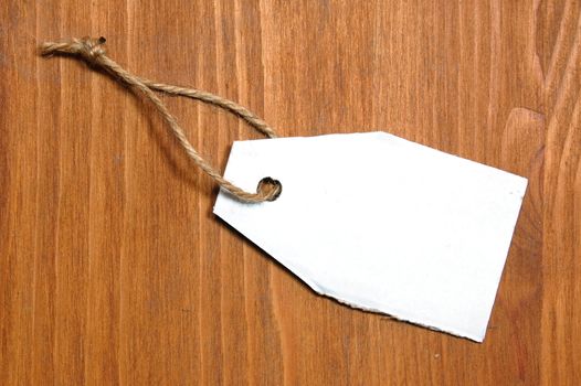 blank price tag with copyspace on a wood texture