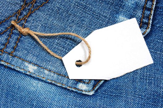 blank price tag with copyspace on a jeans texture