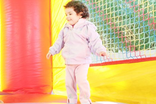 kids playing in inflatable air castle