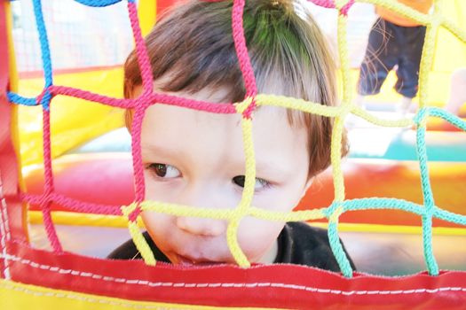 kids playing in inflatable air castle