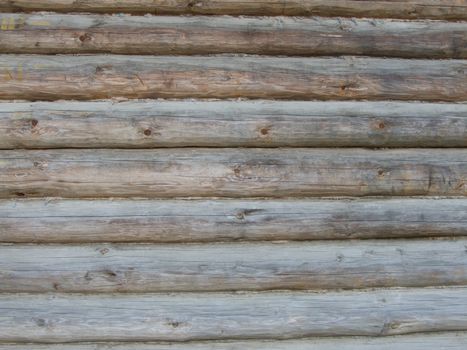 Structure of a wall from wooden logs