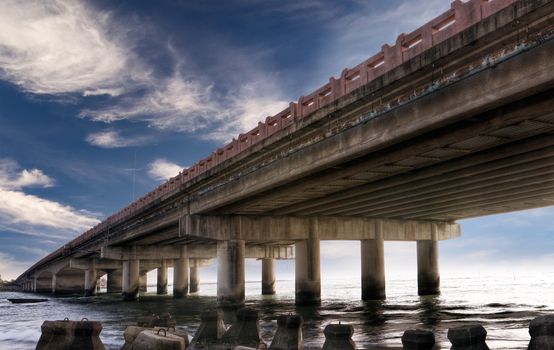 Landscape of ocean with bridge architecture.
