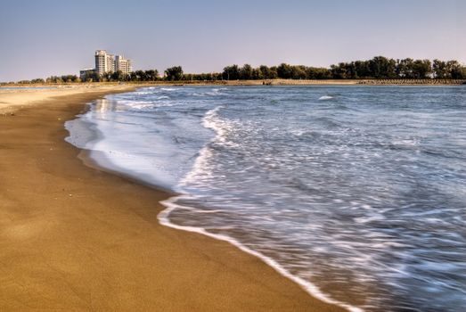 Color beach with sand and wave on vacation.