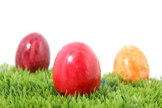 three easter eggs on grass