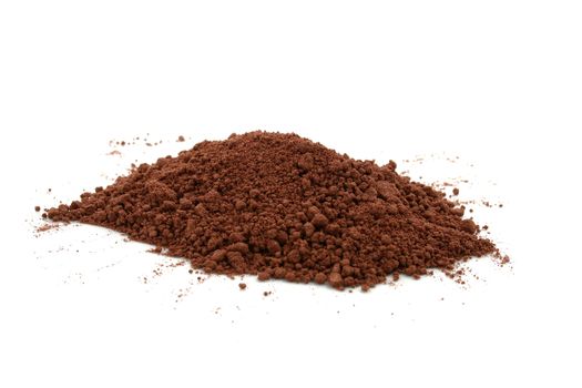 a pile of cocoa powder on white background