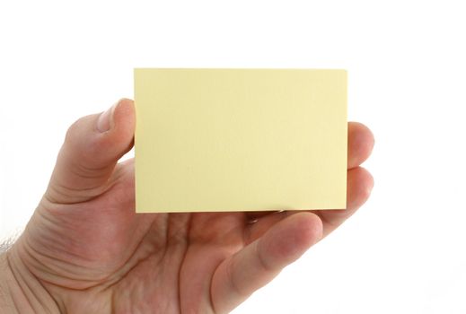 a hand holding a yellow paper