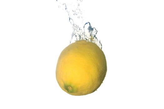 a lemon splashing in water