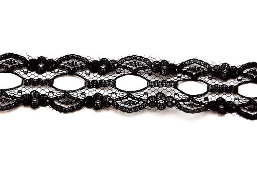 Black delicate lace on white background isolated