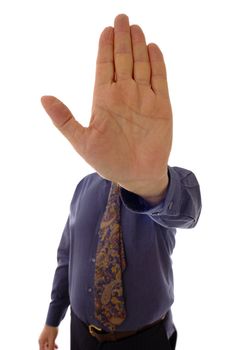 A senior businessman, in shirtsleeves, holding up his hand in a stop sign.