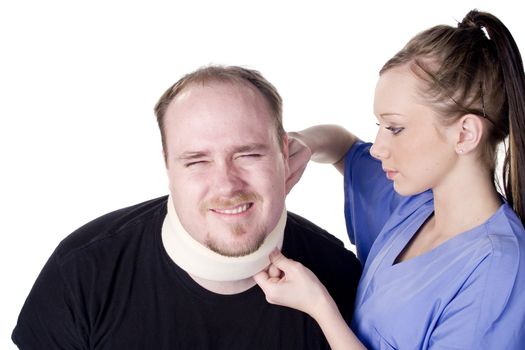Nurse applying neck brace on man in pain
