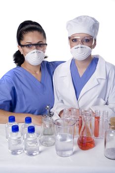 Young scientist in laboratory with test tubes and chemicals