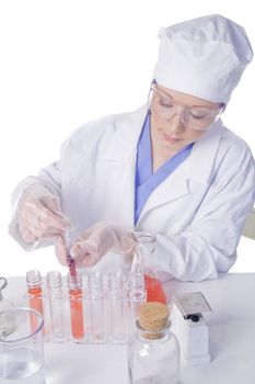 Young scientist in laboratory with test tubes and chemicals