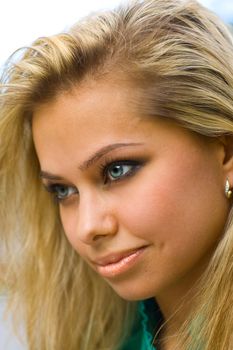 A close-up portrait of a beautiful blond model