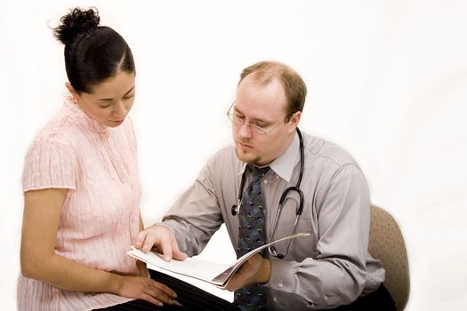 Doctor giving consultation or results to hispanic woman