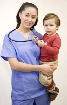 Pretty Hispanic nurse and young child isolated on white 