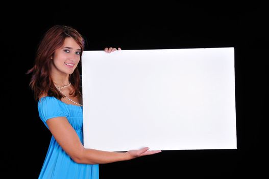 lovely young teen beauty holding a blank sign on black