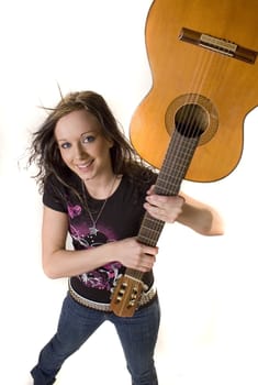 Pretty young rocker girl with guitar