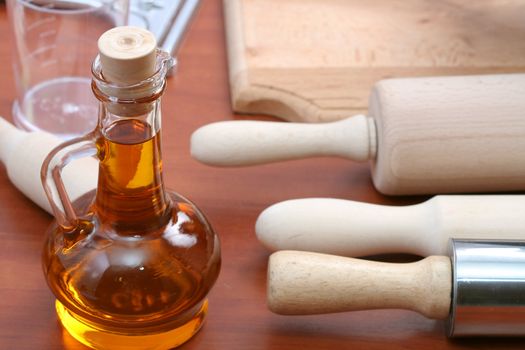 Vegetable oil and kitchen tools, background