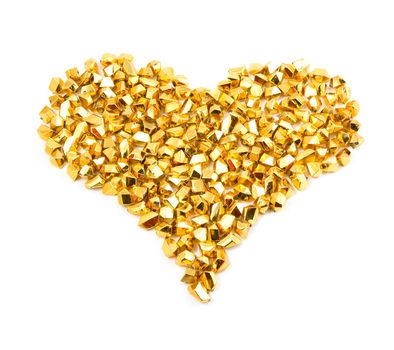 golden particles forming a heart on a white background