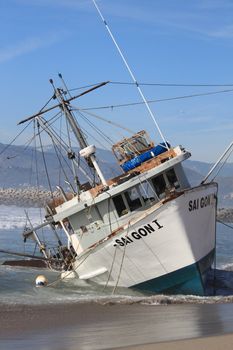 VENTURA, CA, USA - January 8, 2010 - The fishing boat SAI GON I ran aground after 4 people were rescued early morning. The rescue team tried to free the boat throughout the day January 8, 2010 in Ventura, CA