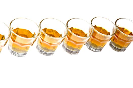 Whisky in glass isolated over white background