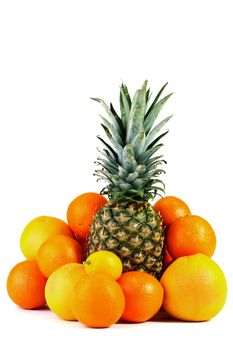 Pineapple with a lemon, oranges and grapefruits.