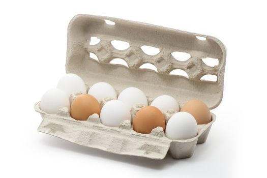 Ten eggs inside carton box isolated on white