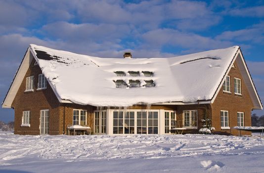 Beautiful modern design house home in winter covered with snow