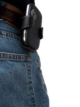 A PDA (Windows Mobile device) in a holster, attached to a belt of an IT worker, wearing jeans, shot from behind, with back pocket visible, isolated on white.