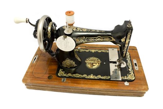 Antique sewing machine isolated on white background