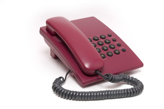 Traditional red phone isolated on white background