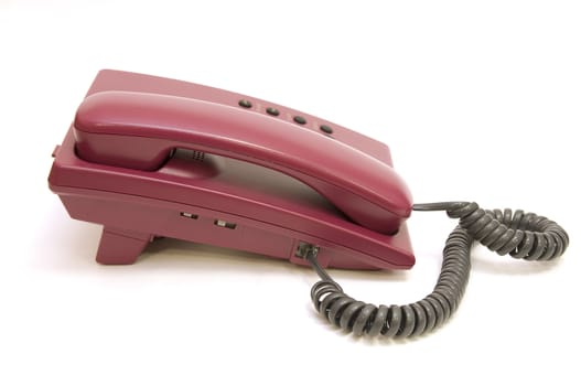 Big office red phone isolated on white background