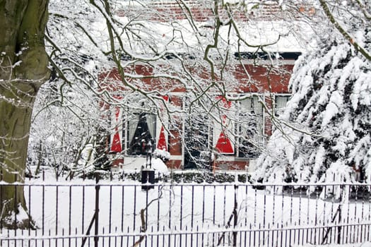 A small cottage in a snowy forest