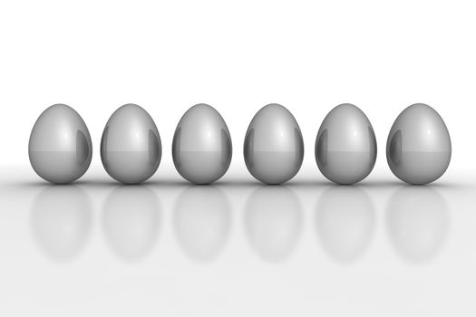 six grey mettallic eggs ordered in a line