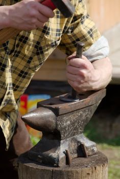 blacksmith making horseshoes