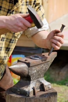 blacksmith making horseshoes