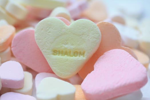 yellow valentine candy heart with Shalom text