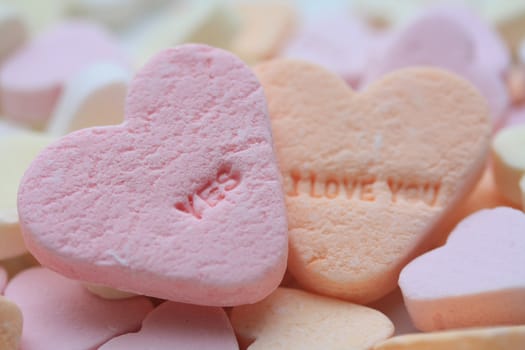 Valentine candy hearts in sweet colors, yes I love you text