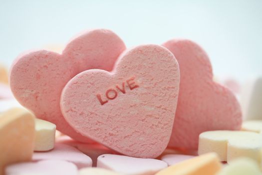 pink candy hearts with the word love