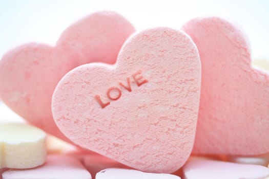 pink candy hearts with the word love